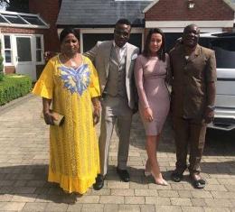(Exclusive Photos) Real Mom & Dad Fly To London For Wedding Of Chelsea Star Moses 